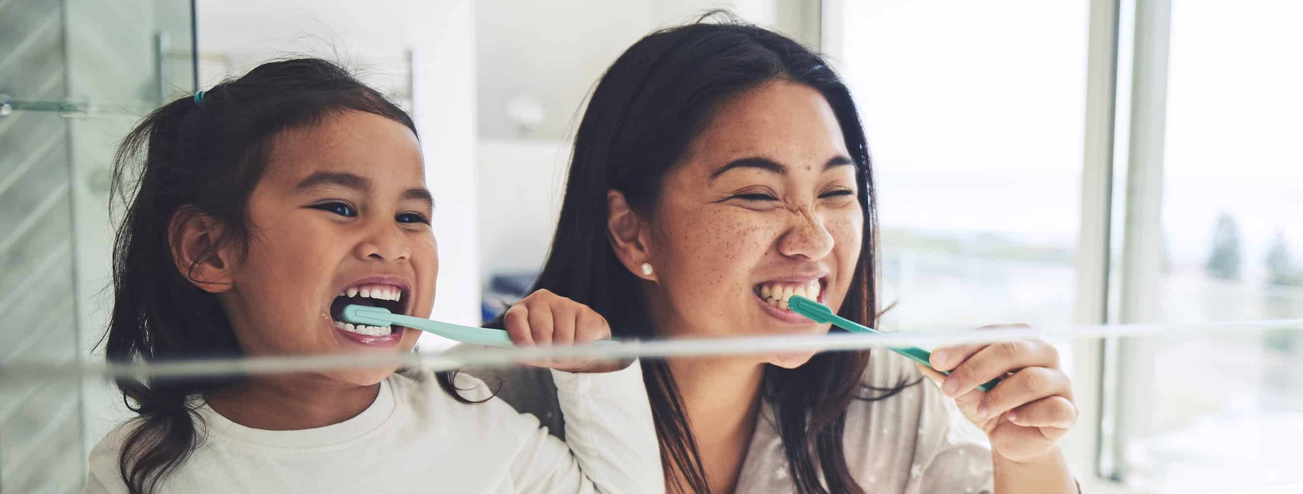 A young girl brushing her teeth in Cincinnati OH.