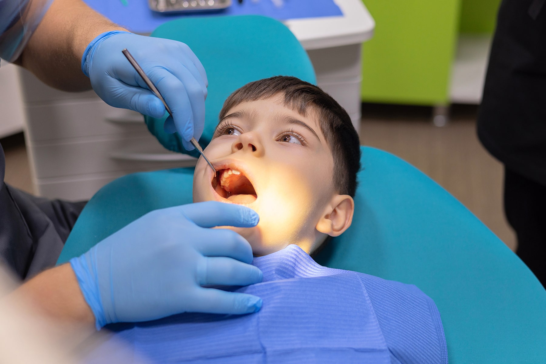 Boy at the resoration dentist in Cincinnati, OH